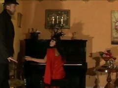 Vintage girl caned on the piano